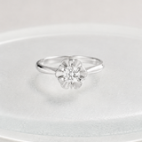 FLOWER RING WITH CENTRAL DIAMOND
