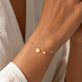 PULSERA DE DISCOS ASSIMÉTRICOS PENDENTES