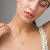 Colgante Oro 9kt topacio London Blue y circonitas Perséfore