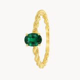 BRAIDED RING WITH EMERALD HENE