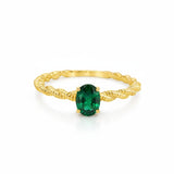 BRAIDED RING WITH EMERALD HENE