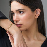 Pulsera rigida de Oro 18kt con nudo Nilsa