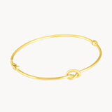 Pulsera rigida Oro 18kt con nudo Nilsa