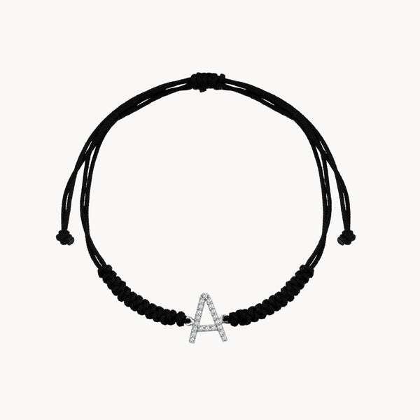 Pulsera Oro blanco 18kt con macrame inicial con circonitas
