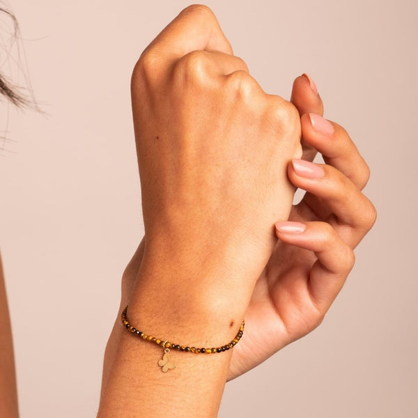 Pulsera Oro 18kt con bolas de ojo de tigre con mariposa Margaret