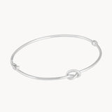 Pulsera rigida Oro blanco 18kt con nudo Nilsa