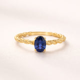 ANEL ENTRELAÇADO COM SAFIRA HENE