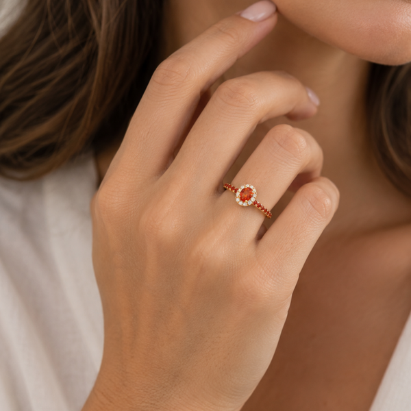 ANILLO ZAFIROS NARANJAS Y ORLA DE DIAMANTES