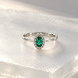 ANILLO ESMERALDA OVAL Y ORLA DE DIAMANTES