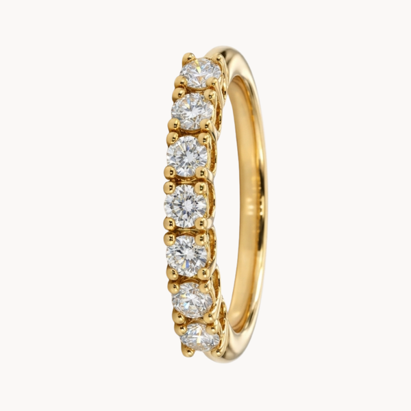 MEIA ALIANÇA COM SETE DIAMANTES BRILHANTES
