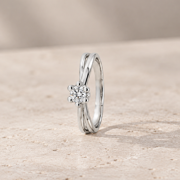 Solitaire ring with intertwined bands