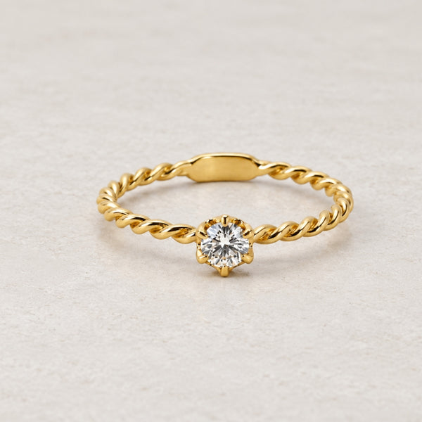 ANILLO SOLITARIO TRENZADO CON DIAMANTE 0.20 QUILATES