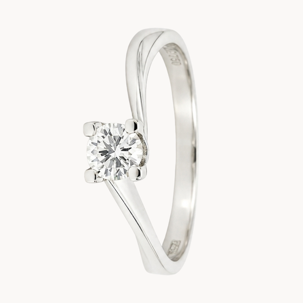 ANILLO SOLITARIO EN BRAZOS ASIMETRICOS