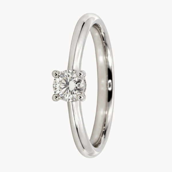 ANILLO SOLITARIO BANDA REDONDA CUATRO GARRAS CON DIAMANTE 0.24 QUILATES