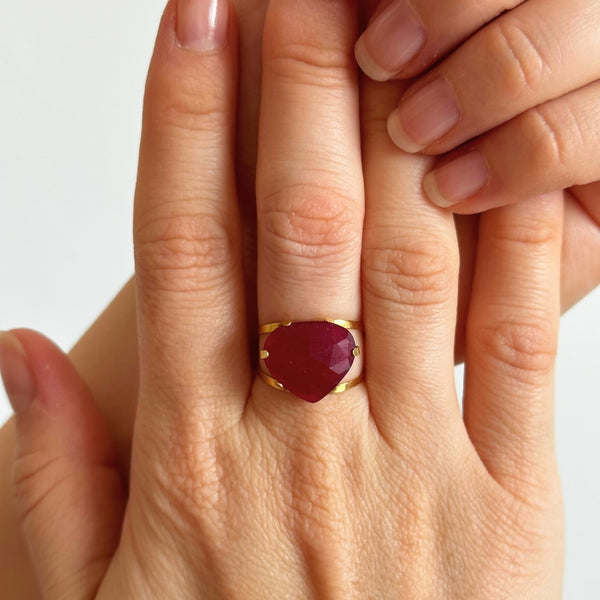 RED QUARTZ RING IN CLAWS