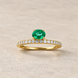 OVAL EMERALD AND DIAMOND RING