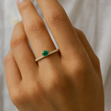 OVAL EMERALD AND DIAMOND RING