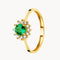 ANILLO DIANE ESMERALDA REDONDO CON ORLA DE DIAMANTES CREADOS