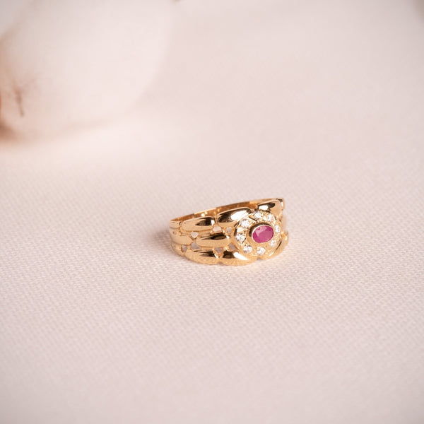 ANILLO PANTER CON RUBI OVAL Y CIRCONITAS