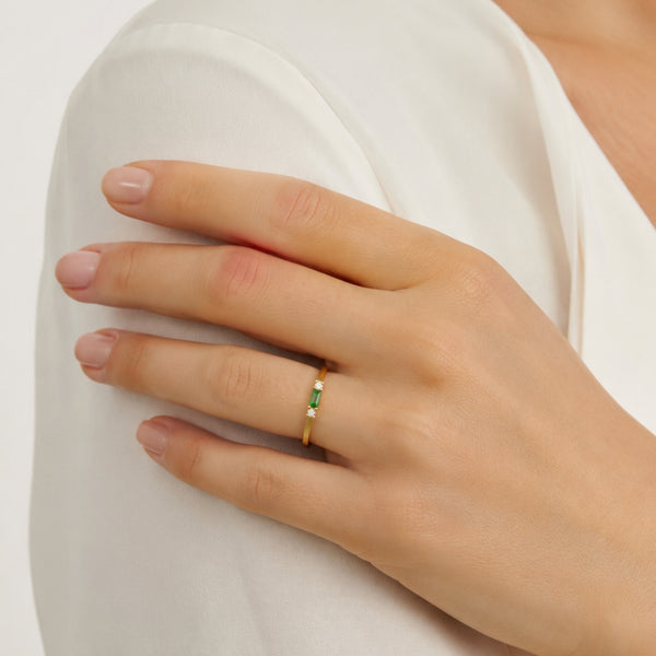 Thin vertical ring with green and white cubic zirconia stones