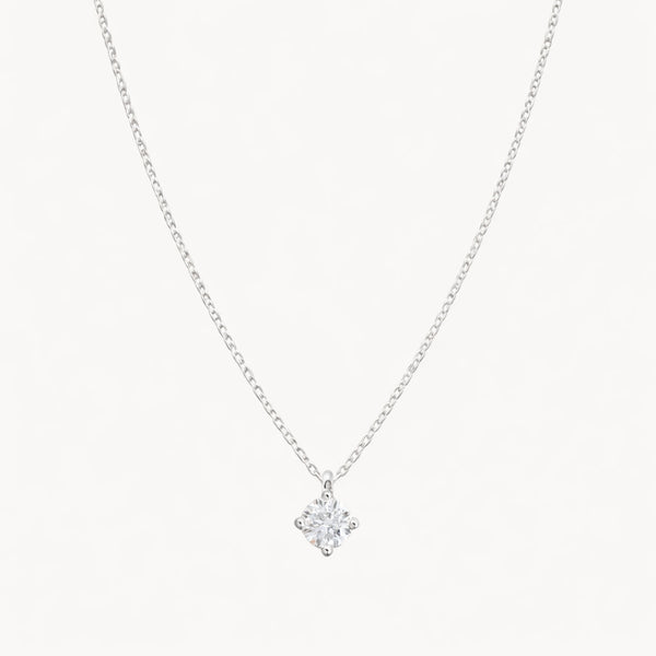 COLGANTE CON DIAMANTE GARRAS ROMBO 0.20 QUILATES PUNTO DE LUZ