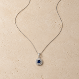 COLGANTE ZAFIRO CON DOBLE ORLA DE DIAMANTES