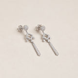 Long diamond-shaped earrings with diamonds