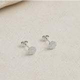 Earrings with wavy edges and diamonds