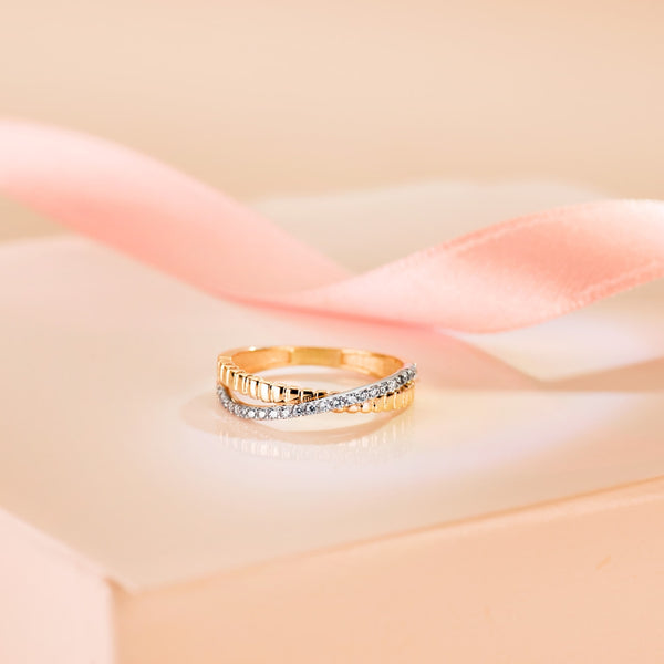 Two-tone crossover ring with cubic zirconia stones