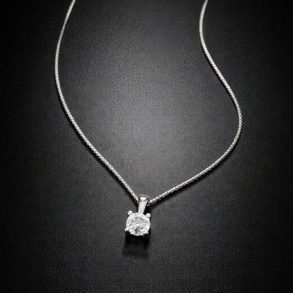 COLGANTE CON DIAMANTE GARRAS 0.15 QUILATES PUNTO DE LUZ