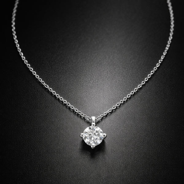 COLGANTE CON DIAMANTE GARRAS ROMBO 0.25 QUILATES PUNTO DE LUZ