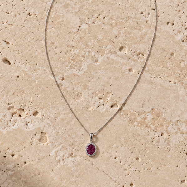 COLGANTE RUBIES CON HALO DE DIAMANTES