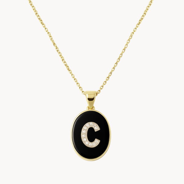 COLGANTE OVAL INICIAL CON DIAMANTES Y ONIX