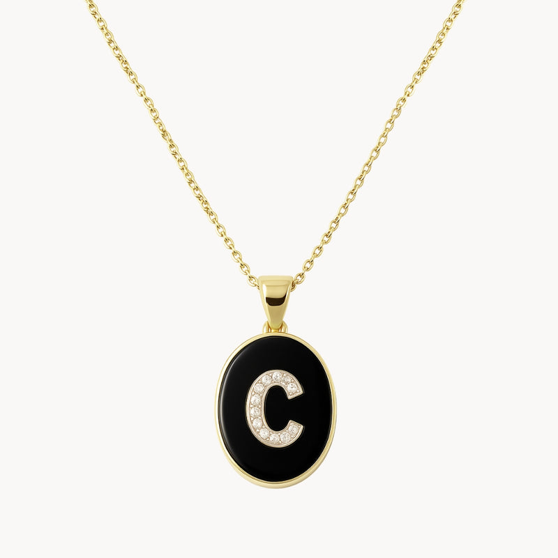 COLGANTE OVAL INICIAL CON DIAMANTES Y ONIX