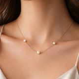 NECKLACE WITH PEARLS AND HAZEL BALLS