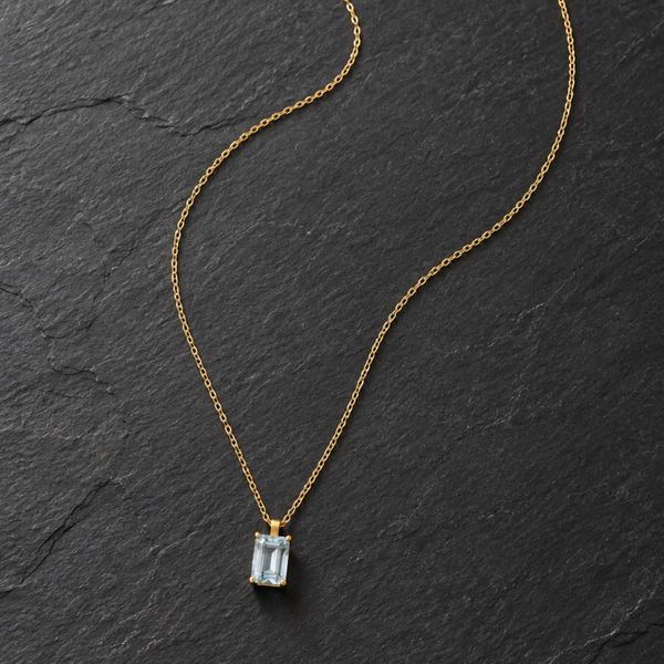 COLGANTE AGUAMARINA TALLA BAGUETTE EN GARRAS