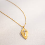 COLGANTE CHAPA CON DIAMANTES Y CRUZ