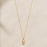 Oval pendant with two diamonds in a chaton setting