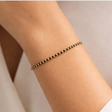 Armband mit Goldbeuteln und Onyx Ishali