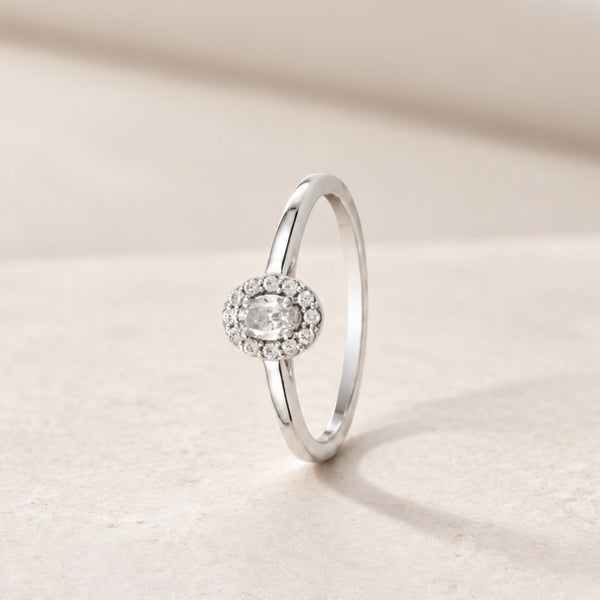 ANILLO DIAMANTE TALLA OVAL CON HALO DE DIAMANTES