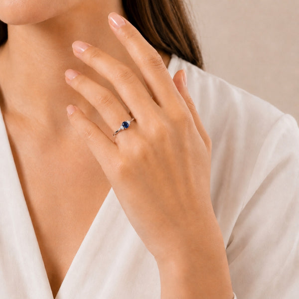 OVAL SAPPHIRE AND MARQUISE CREATED DIAMOND RING