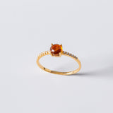 Anillo Oro 18 kilates con turmalina naranja y diamantes Amaranta