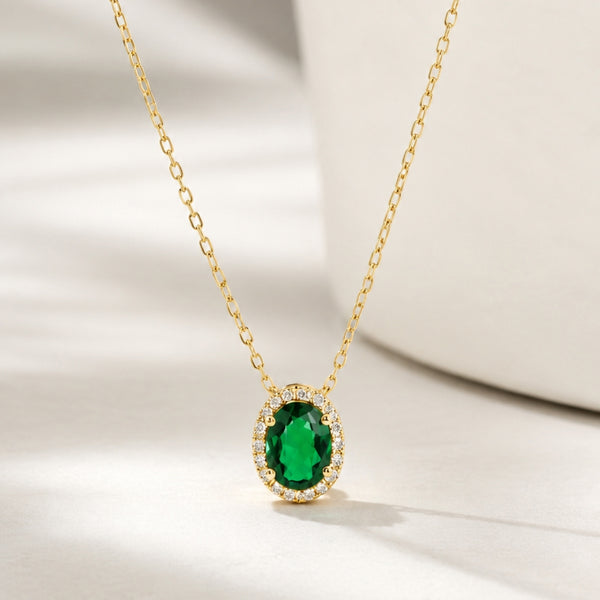 OVAL PENDANT WITH EMERALD AND DIAMOND HALO