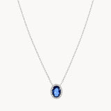 COLGANTE OVALADO CON ZAFIRO Y ORLA DE DIAMANTES