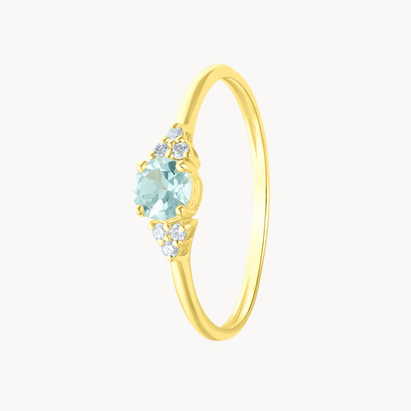 Anillo Oro 18 kilates topacio azul y diamantes Nikol