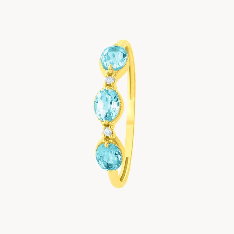 ANILLO ORO 18 KILATES CON TOPACIO LONDON BLUE OVAL Y DIAMANTES COLECCION GAMA